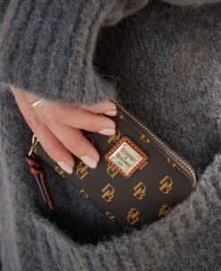 Gretta Large Zip Around Credit Card Case Ivy 20 Gretta Large Zip Around Credit Card Case Ivy -Dooney & Bourke WGRET0322 ILD lifestyle 1